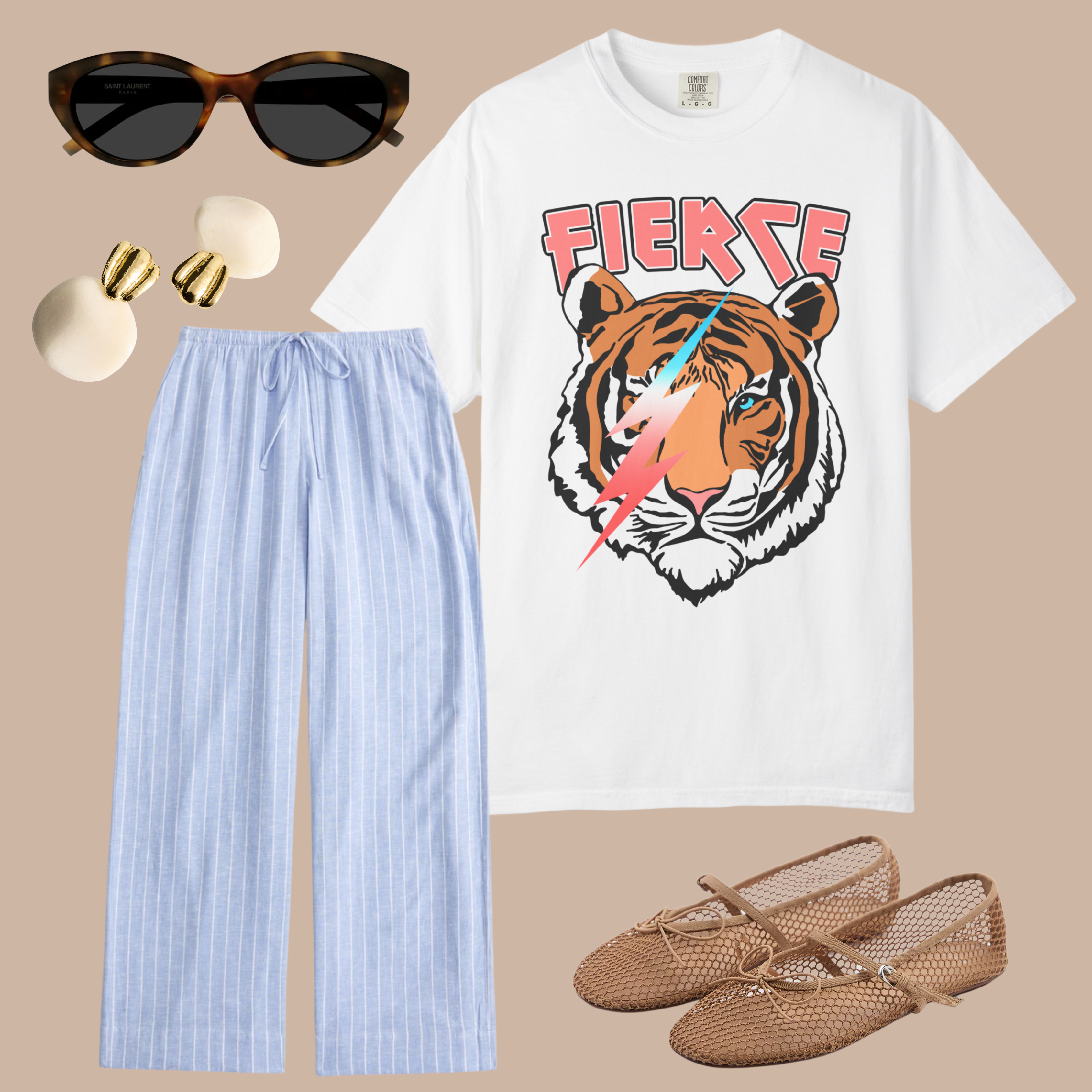 White graphic t-shirt with a tiger and lightning bolt design, styled with blue pinstripe pants, beige mesh flats, gold statement earrings, and cat-eye sunglasses.