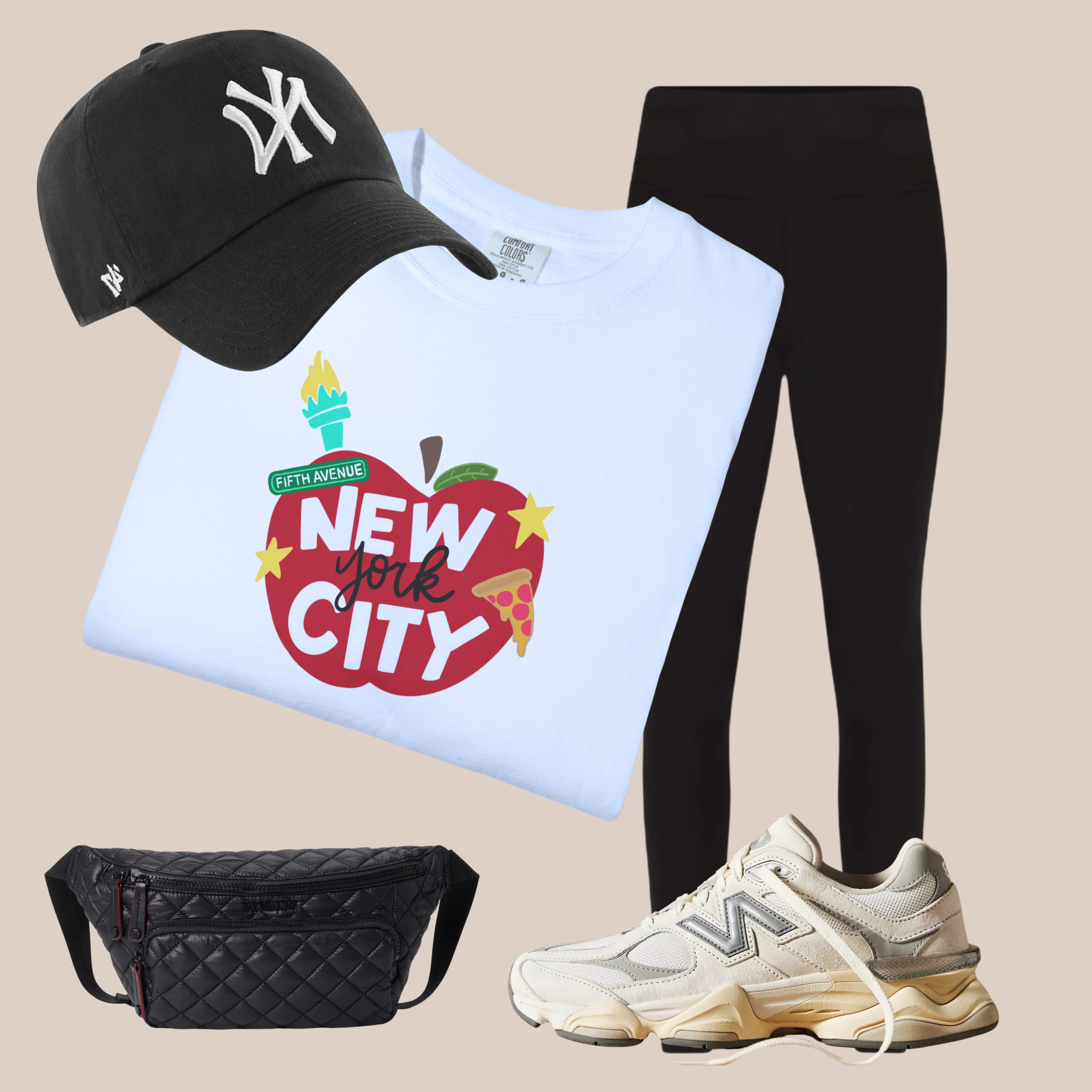 White Comfort Colors t-shirt with New York City apple-themed graphic, styled with black leggings, NY cap, sneakers, and quilted belt bag.